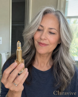 Claravive pH-Adaptive Lipstick — woman holding crystal bullet